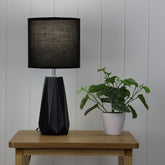 Shelly Black Ceramic Table Lamp styled in a room