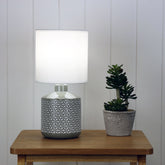 Celia Grey Ceramic Table Lamp styled in a room