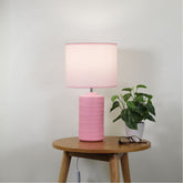 Jenny Pink Ceramic Table Lamp styled in a room