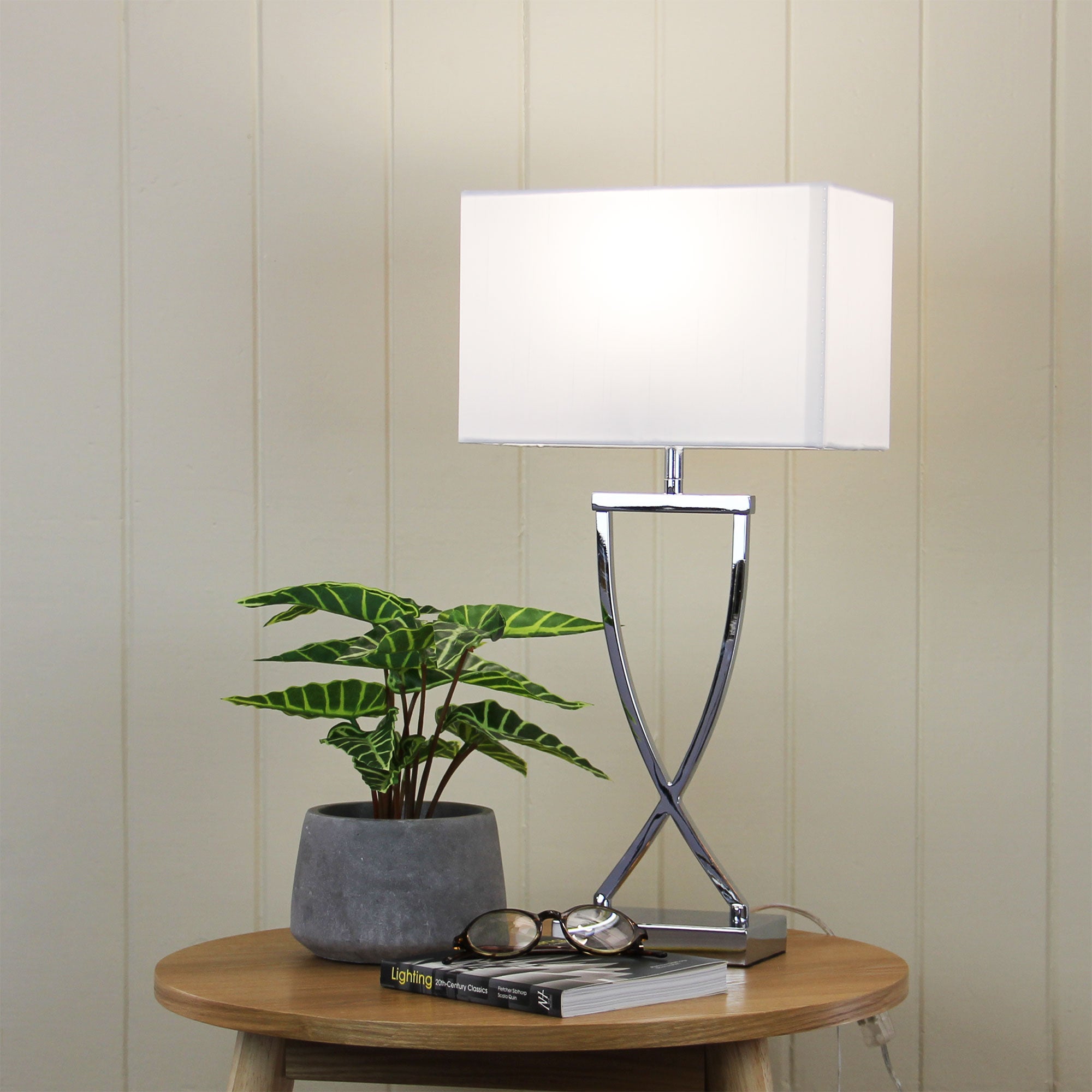 Chi Chrome Complete Bedside Lamp styled in a room