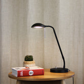 Timo Black LED Desk Lamp styled in a room