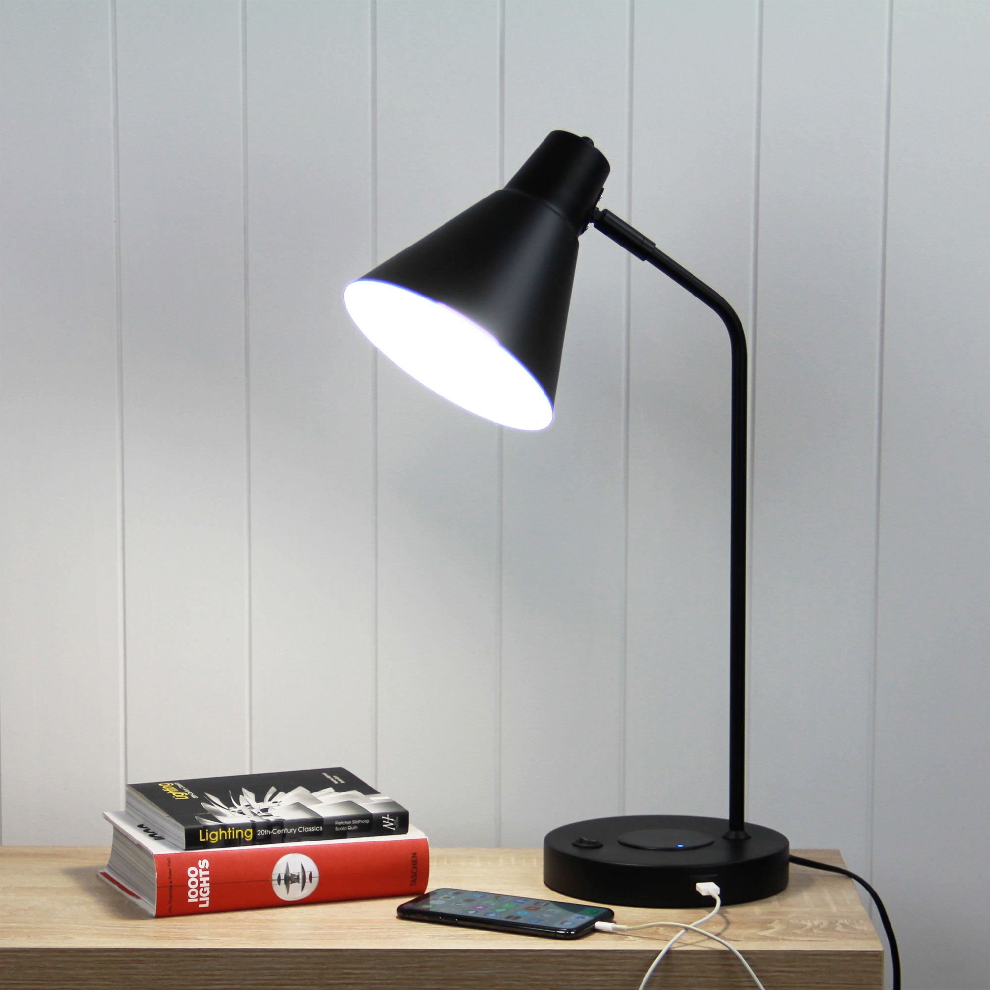 Targa Black Desk Lamp with USB and wireless charging styled in a room