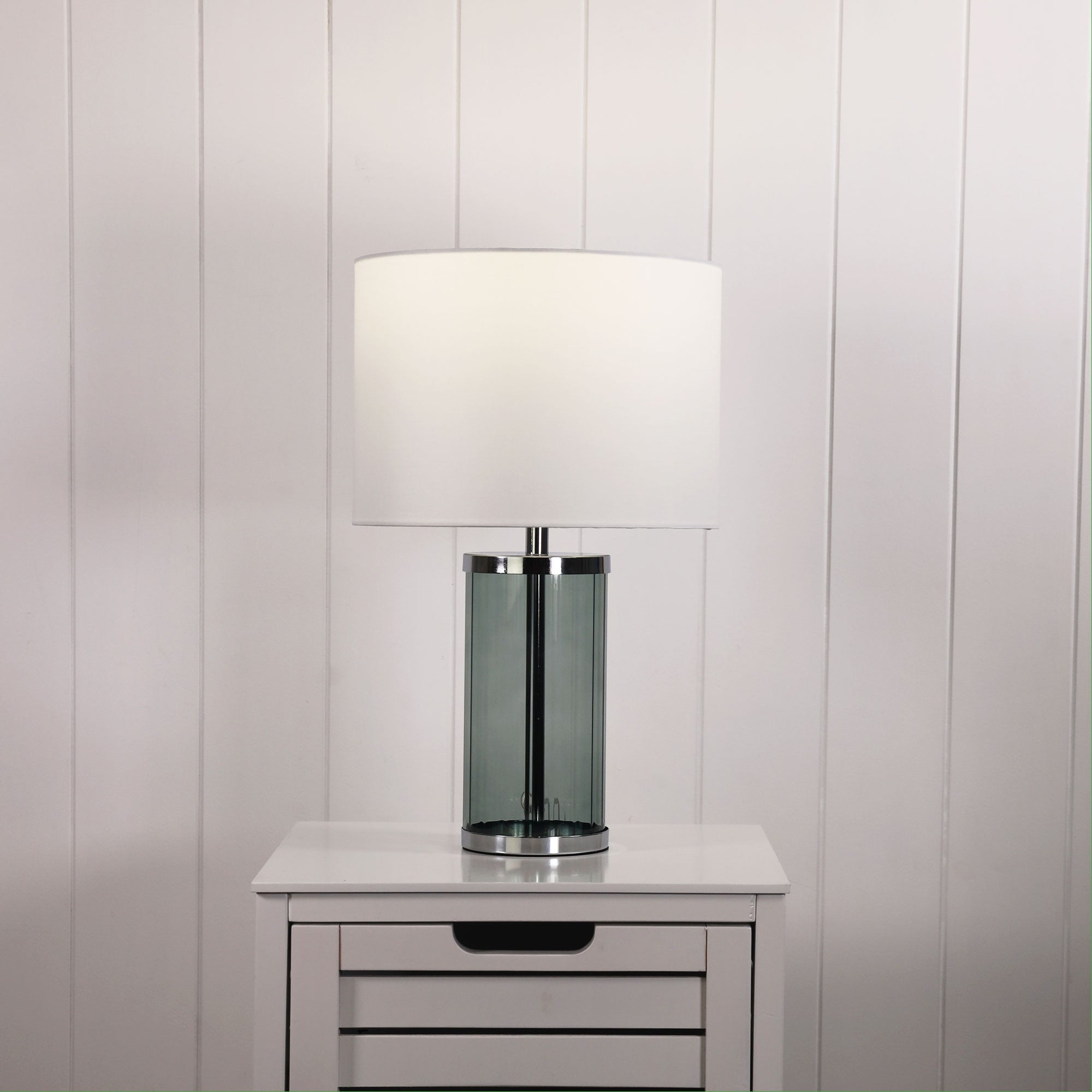 Nizio Green Glass Table Lamp styled in a room