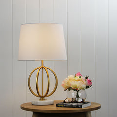 Loxton Gold painted metal/ marble table lamp styled in a room