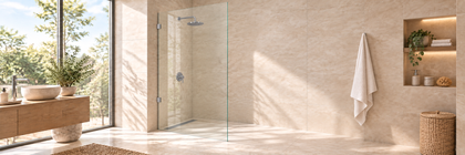 Full-height fixed frameless shower panel with two small chrome wall brackets in a walk-in shower