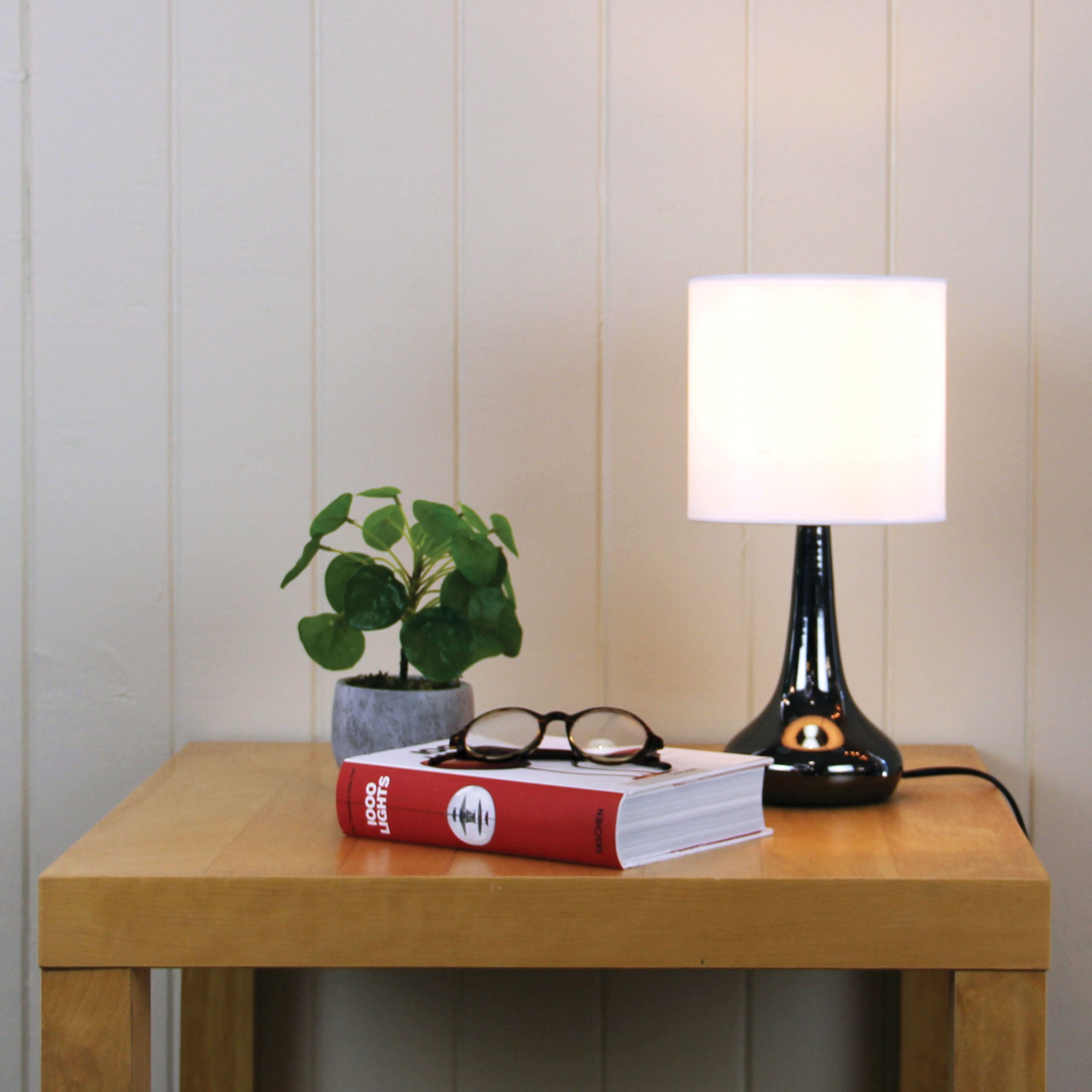 Lola Gunmetal ON / OFF Touch Lamp in Gunmetal Finish styled in a room