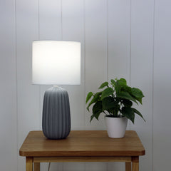 Benjy.20 Grey Ceramic Table Lamp styled in a room