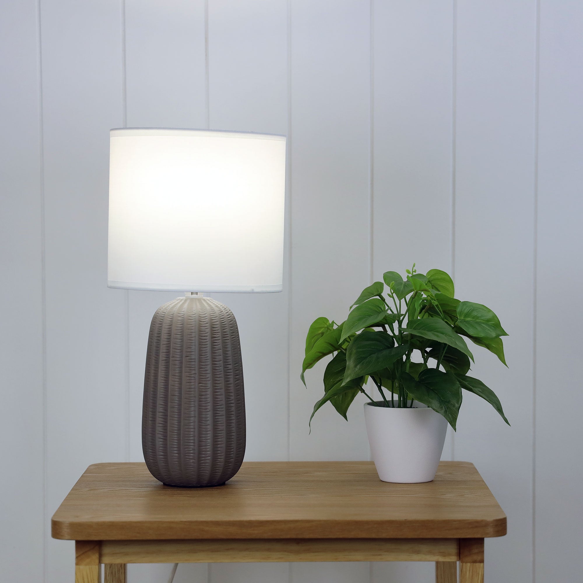Benjy.20 Taupe Taupe Ceramic Table Lamp styled in a room