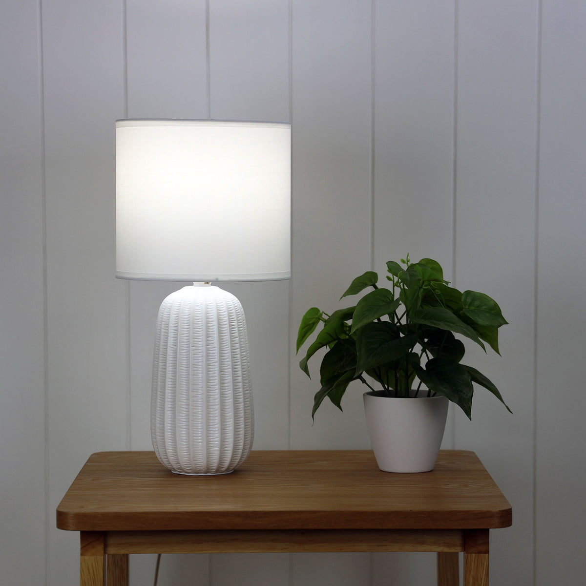 Benjy.20 White Ceramic Table Lamp styled in a room