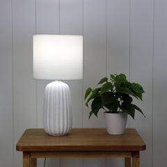 Benjy.20 White Ceramic Table Lamp styled in a room