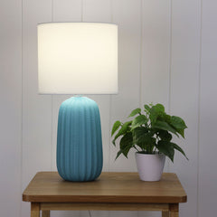 Benjy.25 Blue Ceramic Table Lamp styled in a room