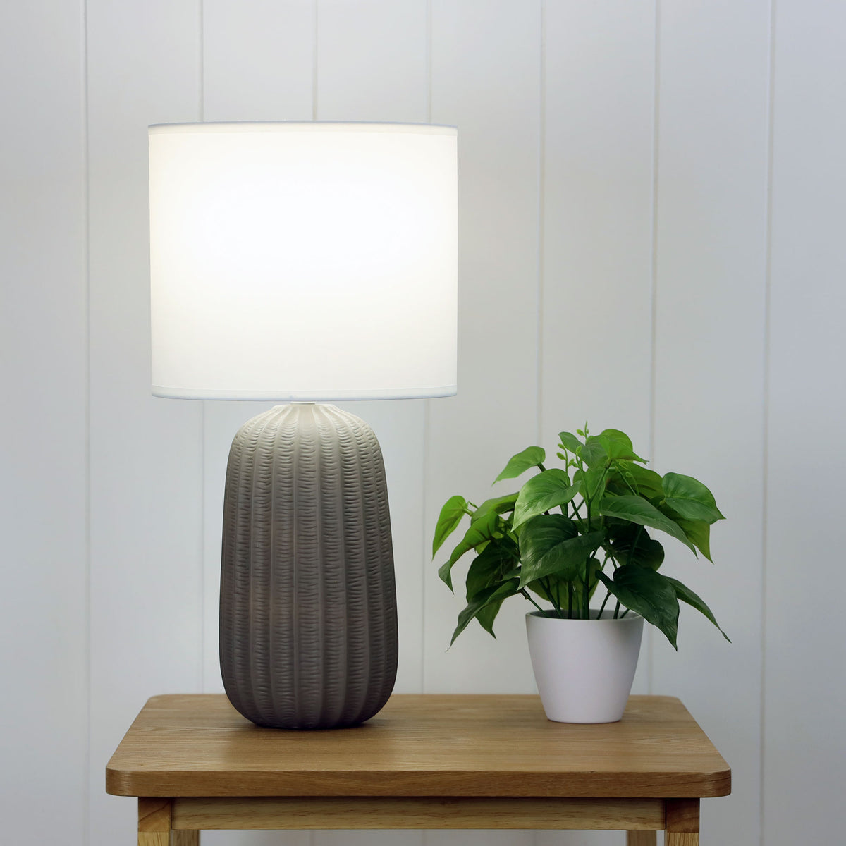 Benjy.25 Taupe Taupe Ceramic Table Lamp styled in a room