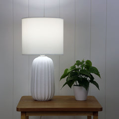Benjy.25 White Ceramic Table Lamp styled in a room