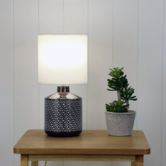 Celia Coffee Coffee Ceramic Table Lamp styled in a room