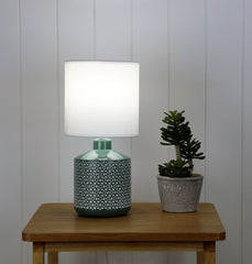Celia Green Ceramic Table Lamp styled in a room