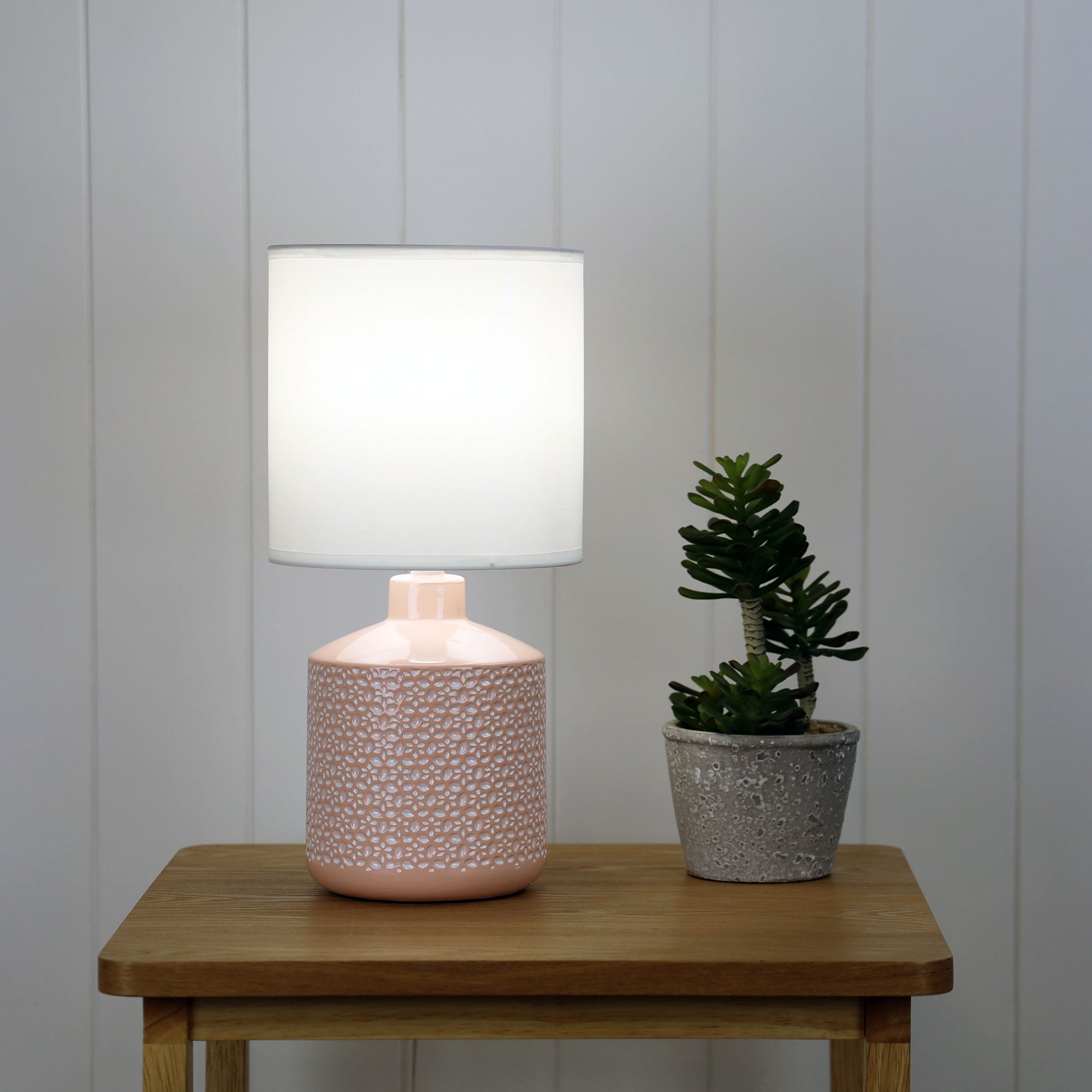 Celia Pink Ceramic Table Lamp styled in a room