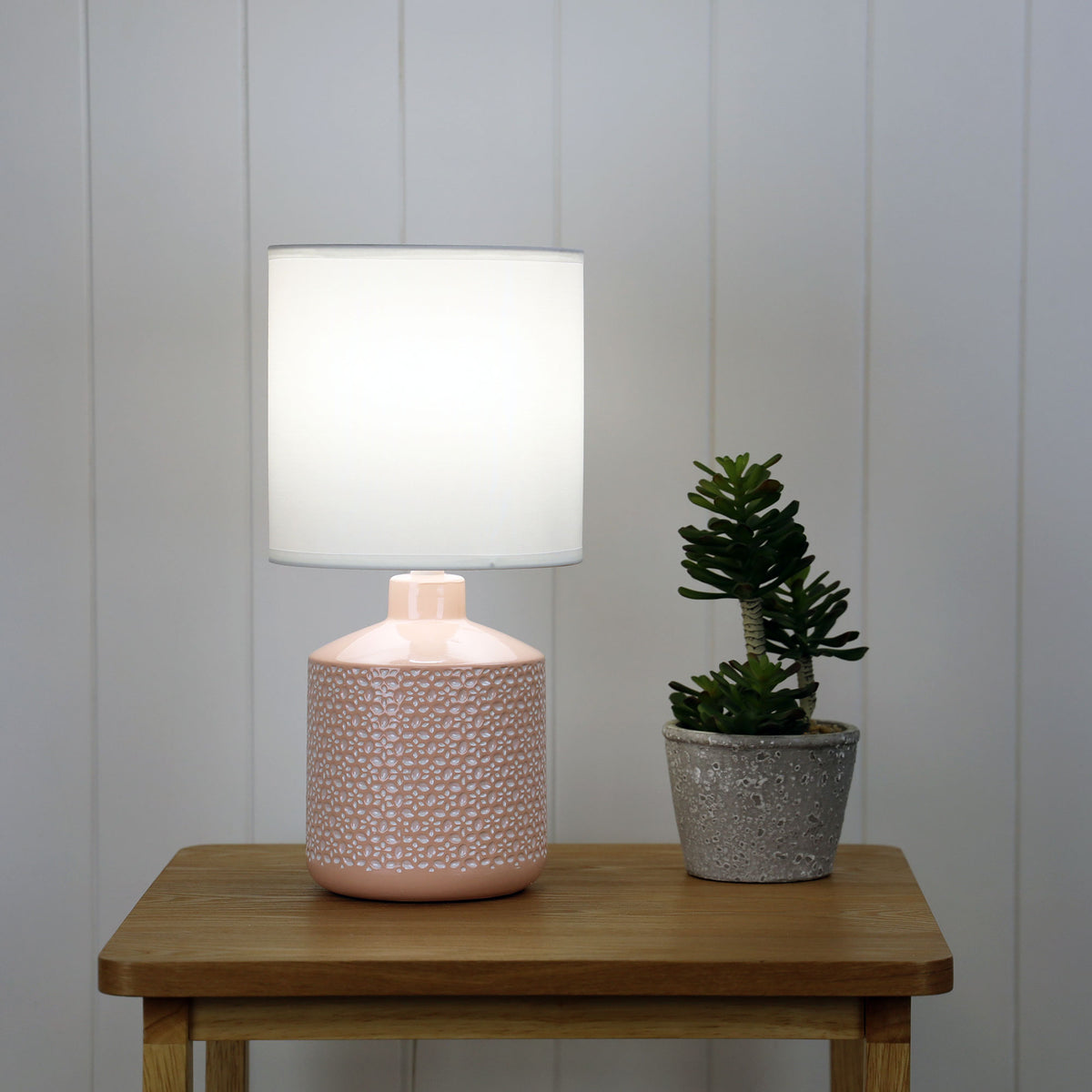 Celia Pink Ceramic Table Lamp styled in a room