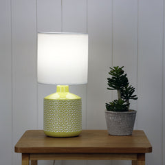 Celia Yellow Yellow Ceramic Table Lamp styled in a room