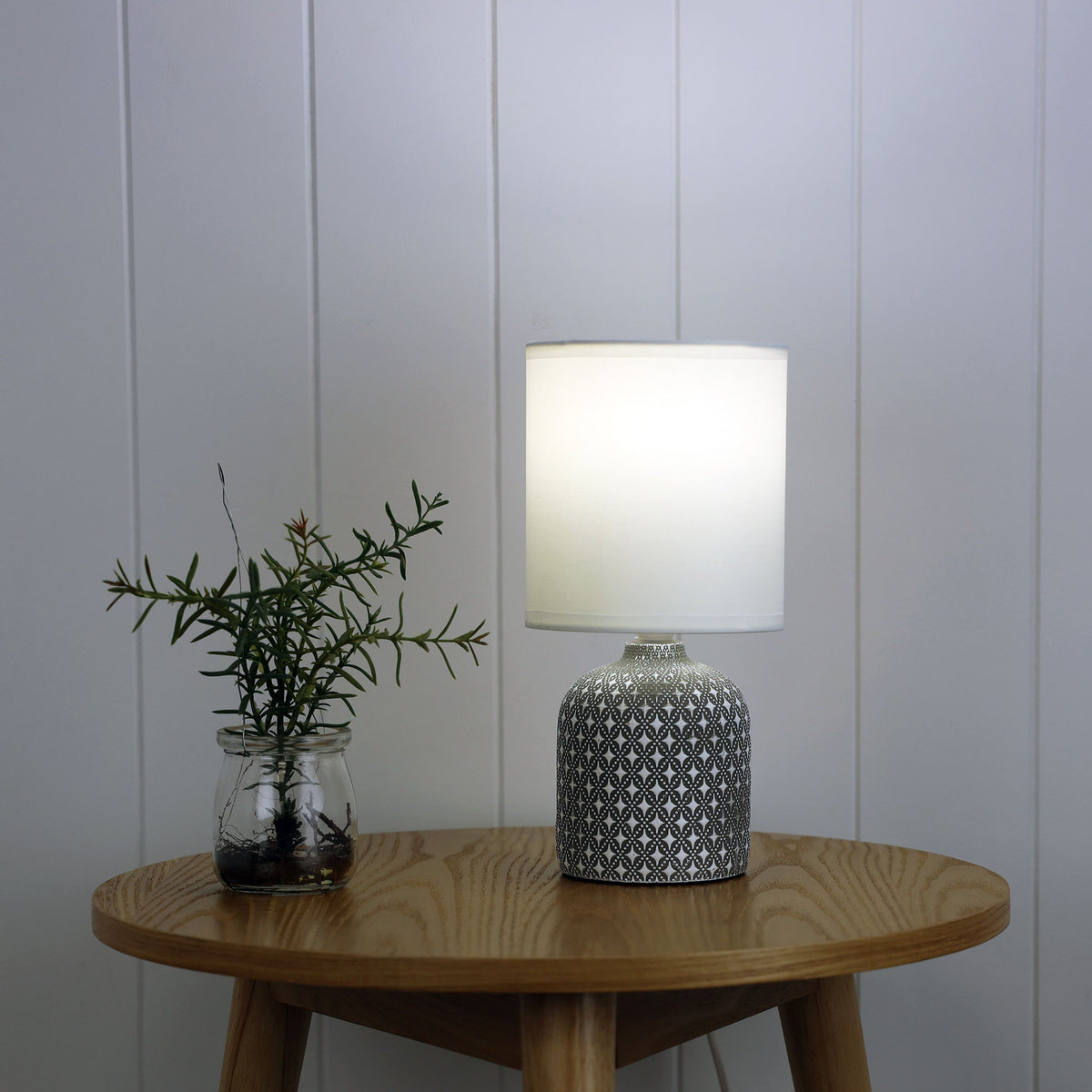 Vera Grey Ceramic Table Lamp styled in a room