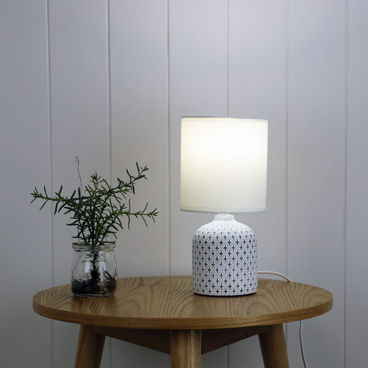 Vera White Ceramic Table Lamp styled in a room