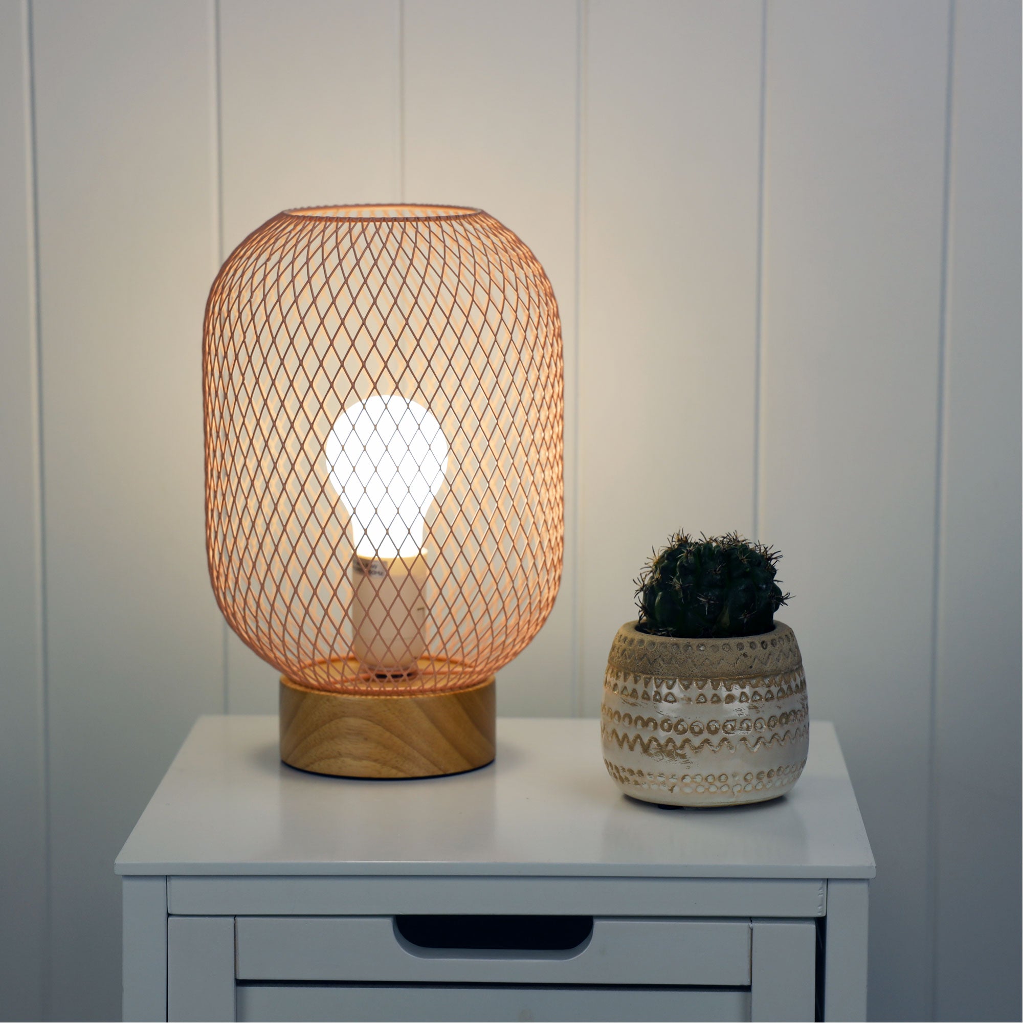 Tilda Pink Mesh Table Lamp styled in a room