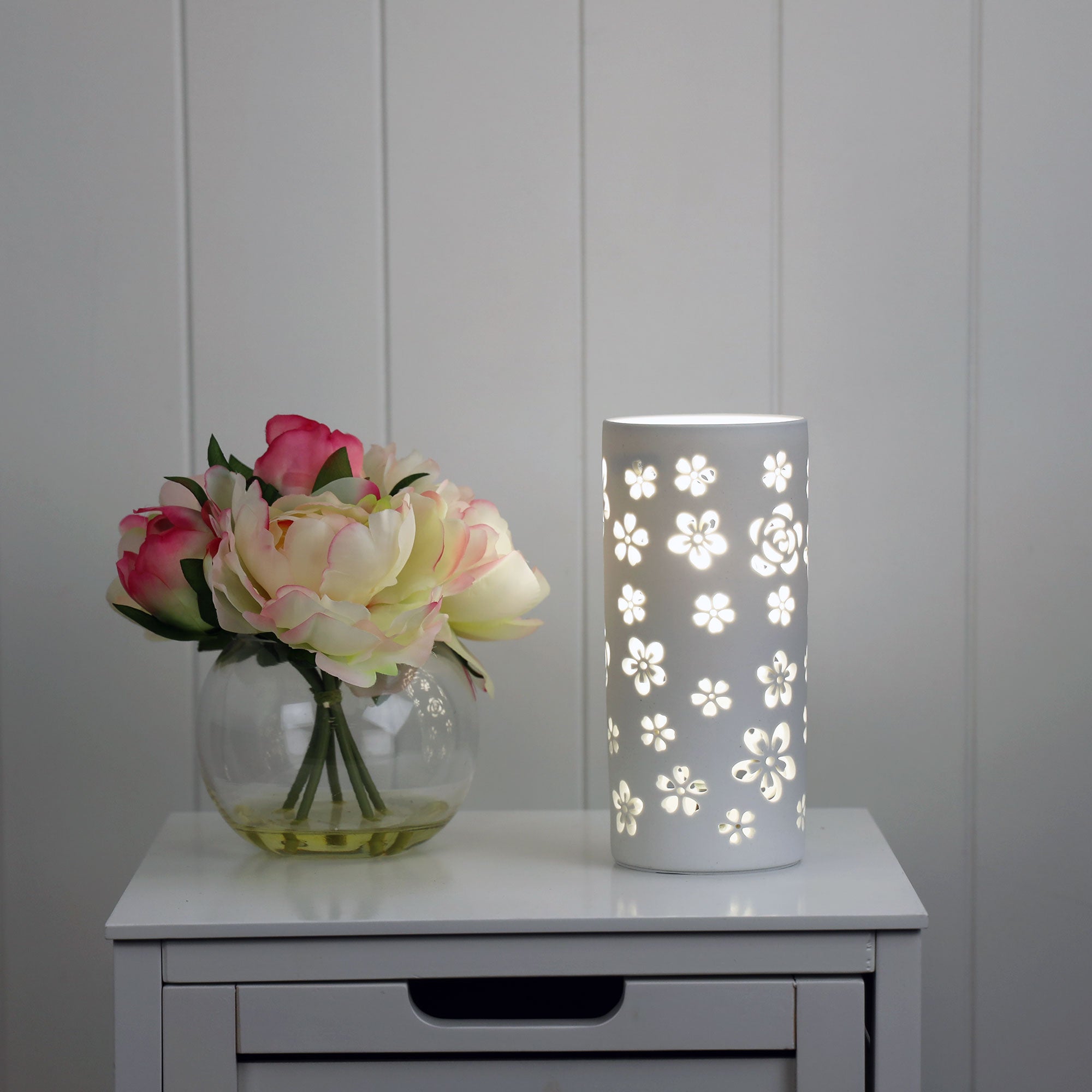 Diana Flower Diana ceramic lamp with flower pattern. styled in a room