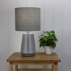 Moana Ceramic Table Lamp with Shade Grey styled in a room
