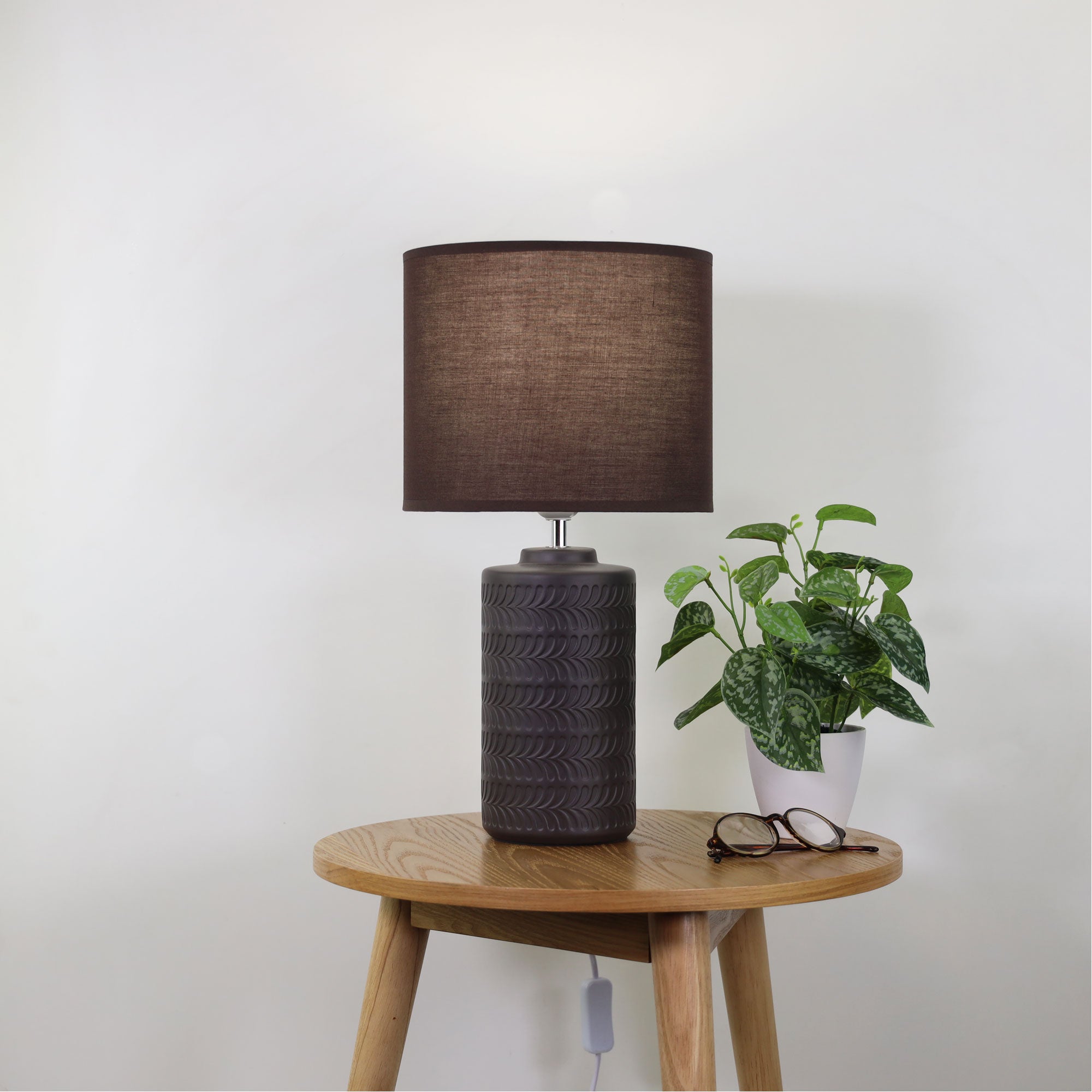 Jenny Coffee Coffee Ceramic Table Lamp styled in a room