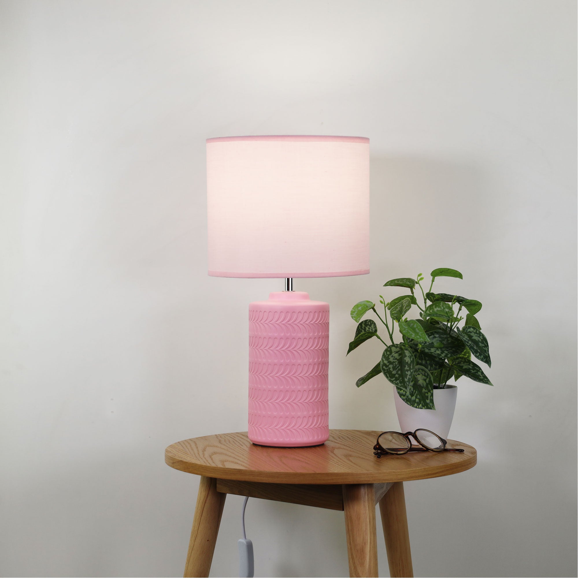 Jenny Pink Ceramic Table Lamp styled in a room