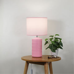 Jenny Pink Ceramic Table Lamp styled in a room