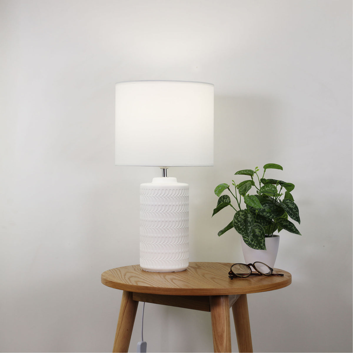 Jenny White Ceramic Table Lamp styled in a room
