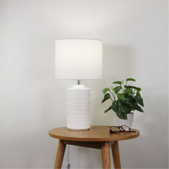 Jenny White Ceramic Table Lamp styled in a room