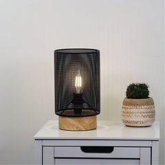 Lenny Mesh Bedside Lamp in Black styled in a room
