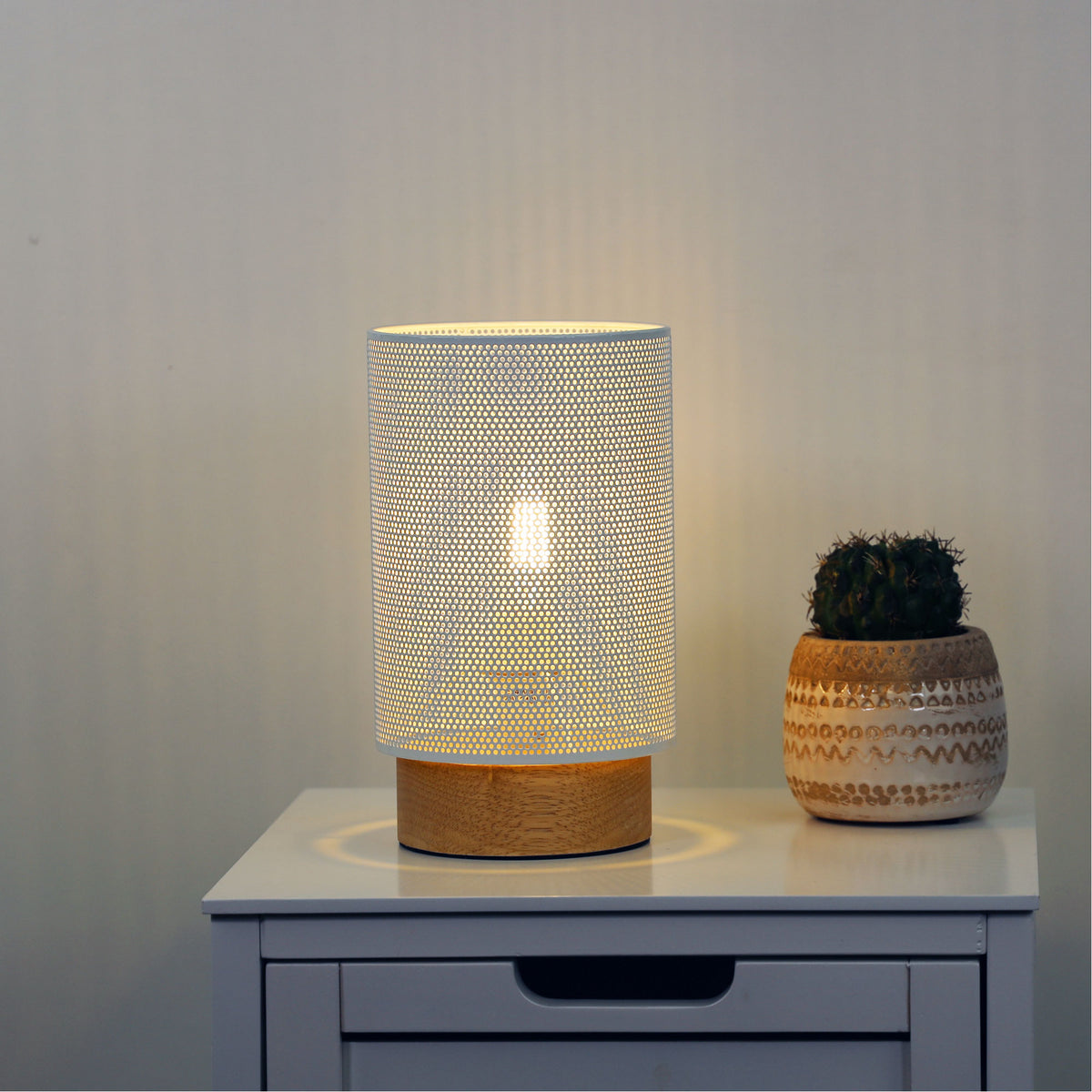 Lenny Mesh Bedside Lamp in White styled in a room