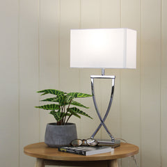 Chi Chrome Complete Bedside Lamp styled in a room