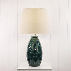 Delphin Ceramic Table Lamp styled in a room
