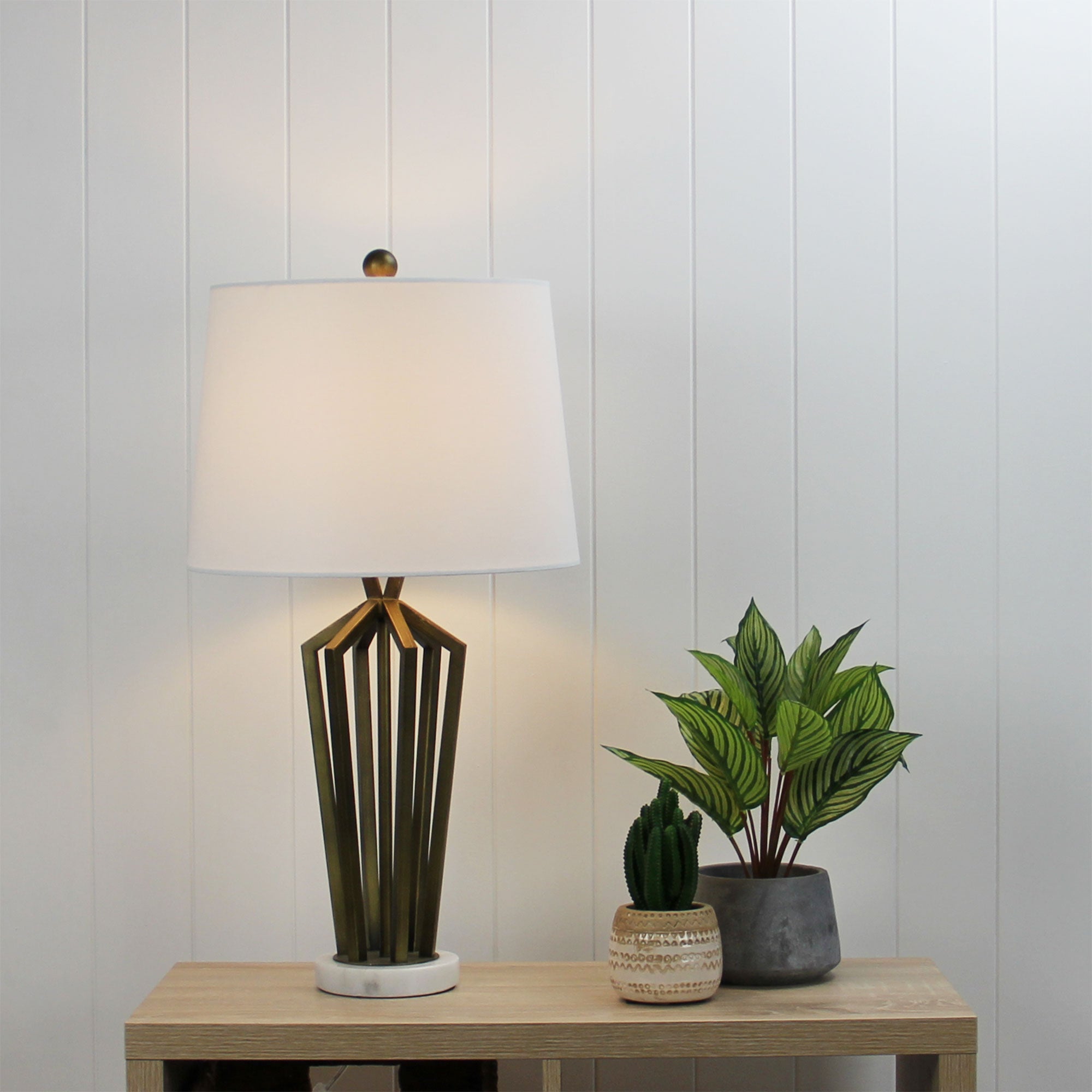 Romsey Geometric Metal Lamp with Harp Shade styled in a room
