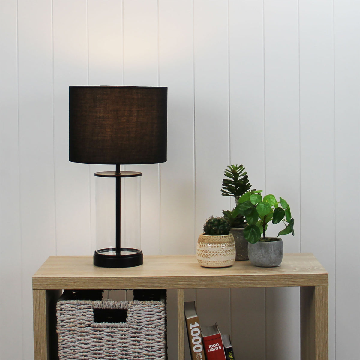 Britt Complete Glass Table Lamp styled in a room