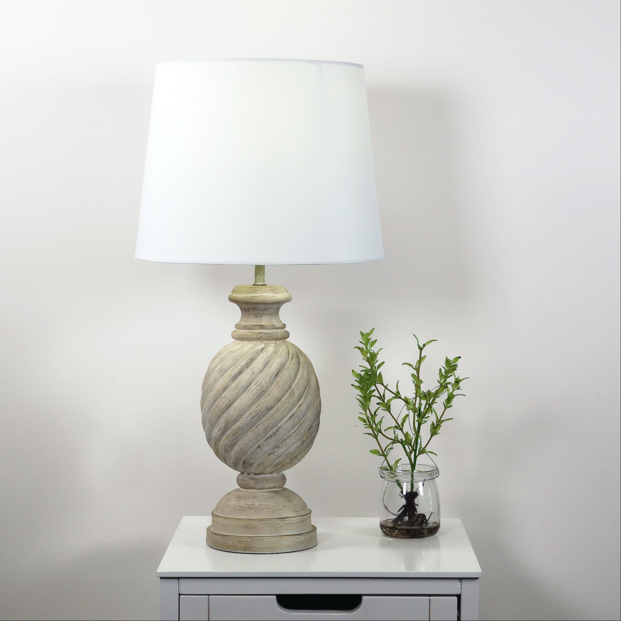 Carlisle Complete Table Lamp styled in a room