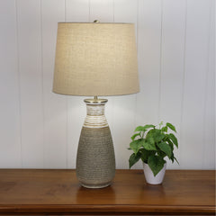 Potton Natural Textured Lamp with Harp Shade styled in a room