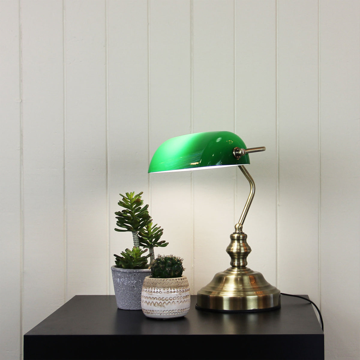 Bankers Antique Brass with Green Glass Shade Desk Lamp styled in a room