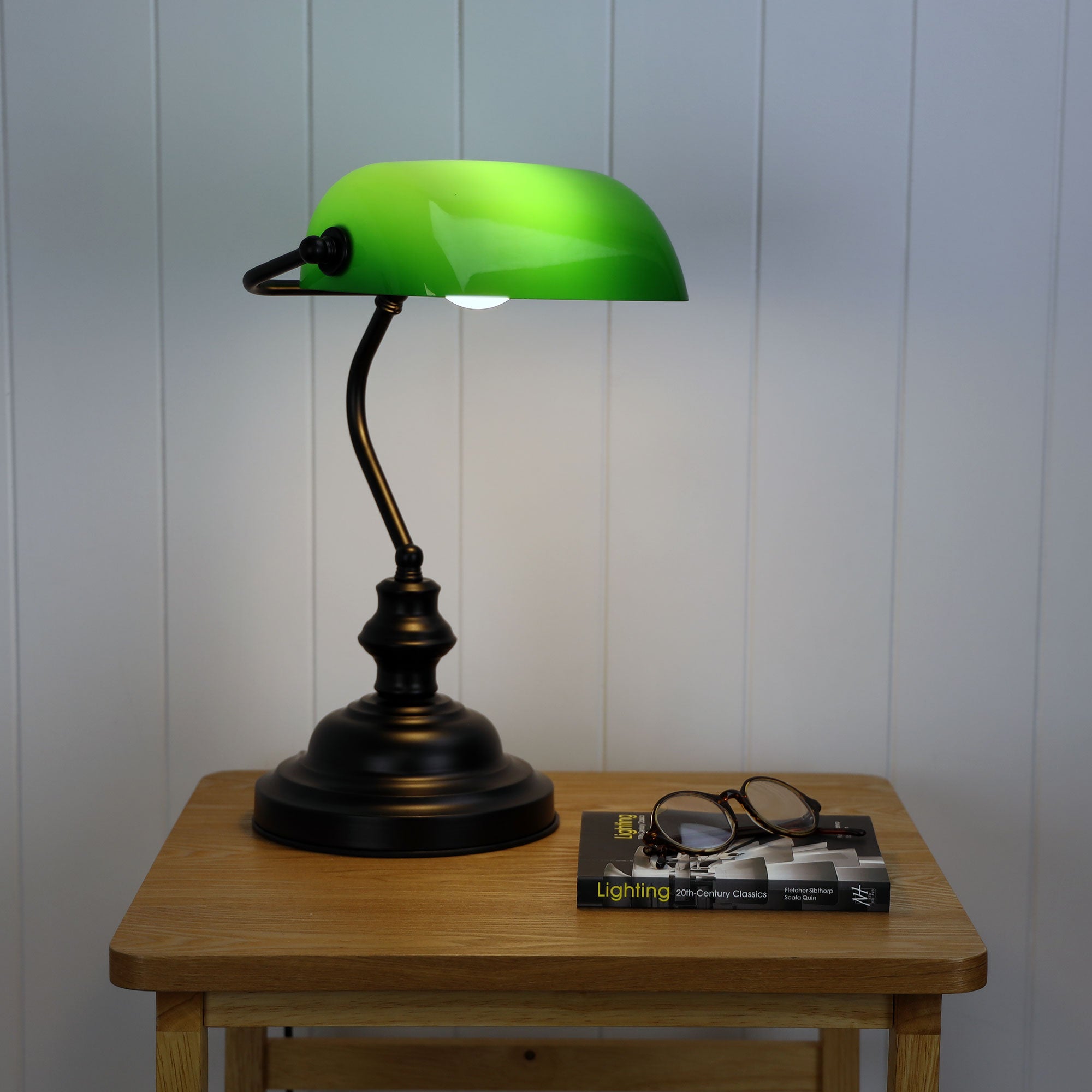 Bankers Black with Green Glass Shade Desk Lamp styled in a room