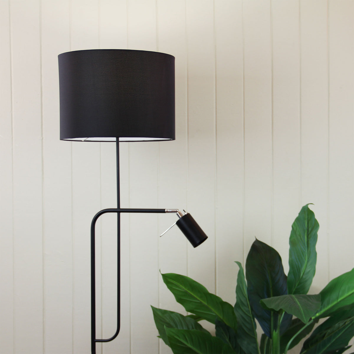 Carmen Floor Lamp with Child styled in a room