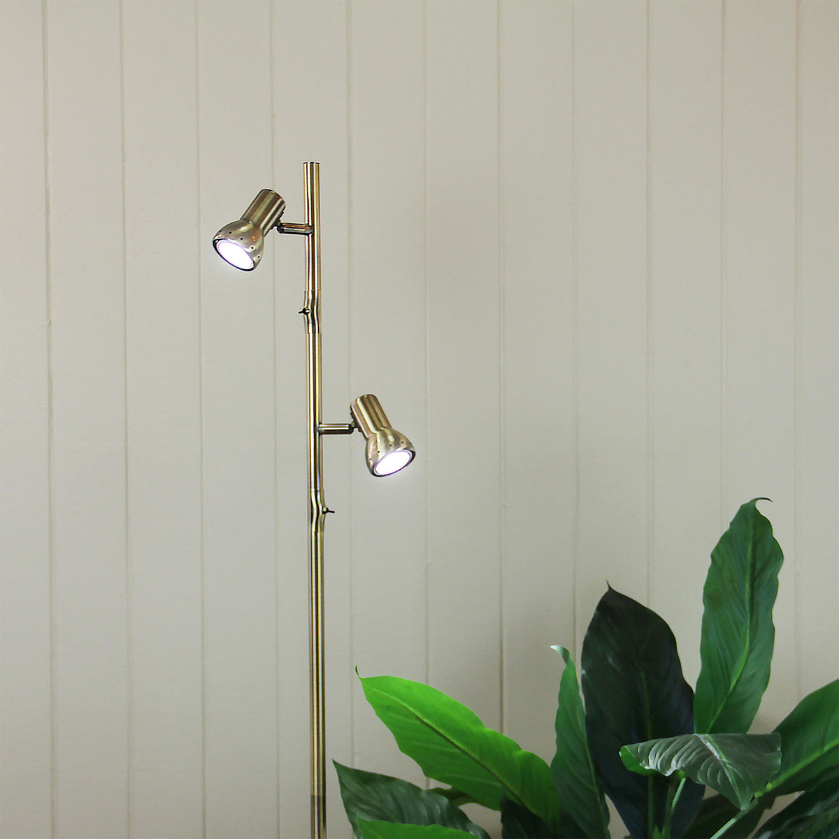 Daxam Twin Adjustable Floor Lamp styled in a room