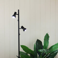 Daxam Twin Adjustable Floor Lamp styled in a room