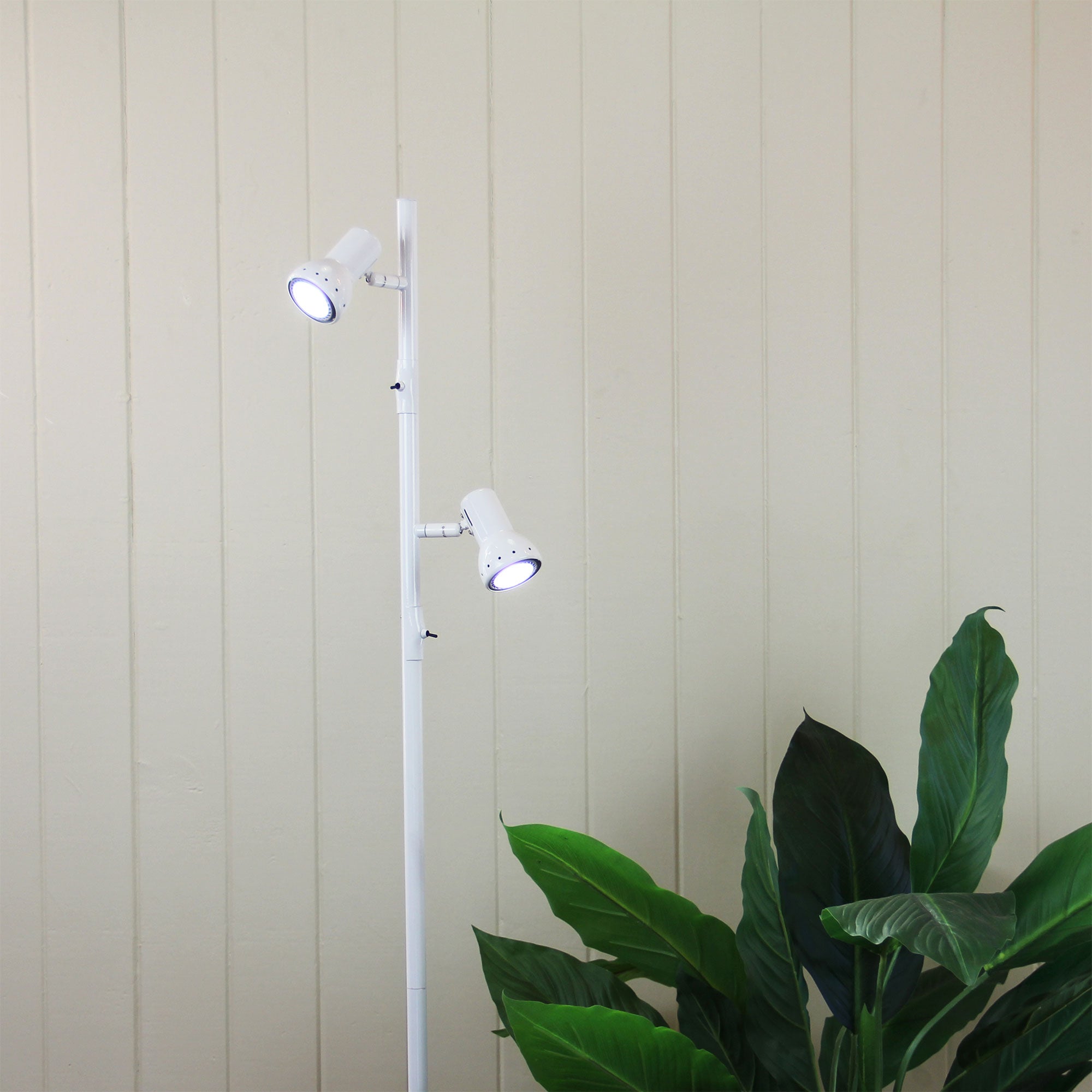 Daxam Twin Adjustable Floor Lamp White styled in a room