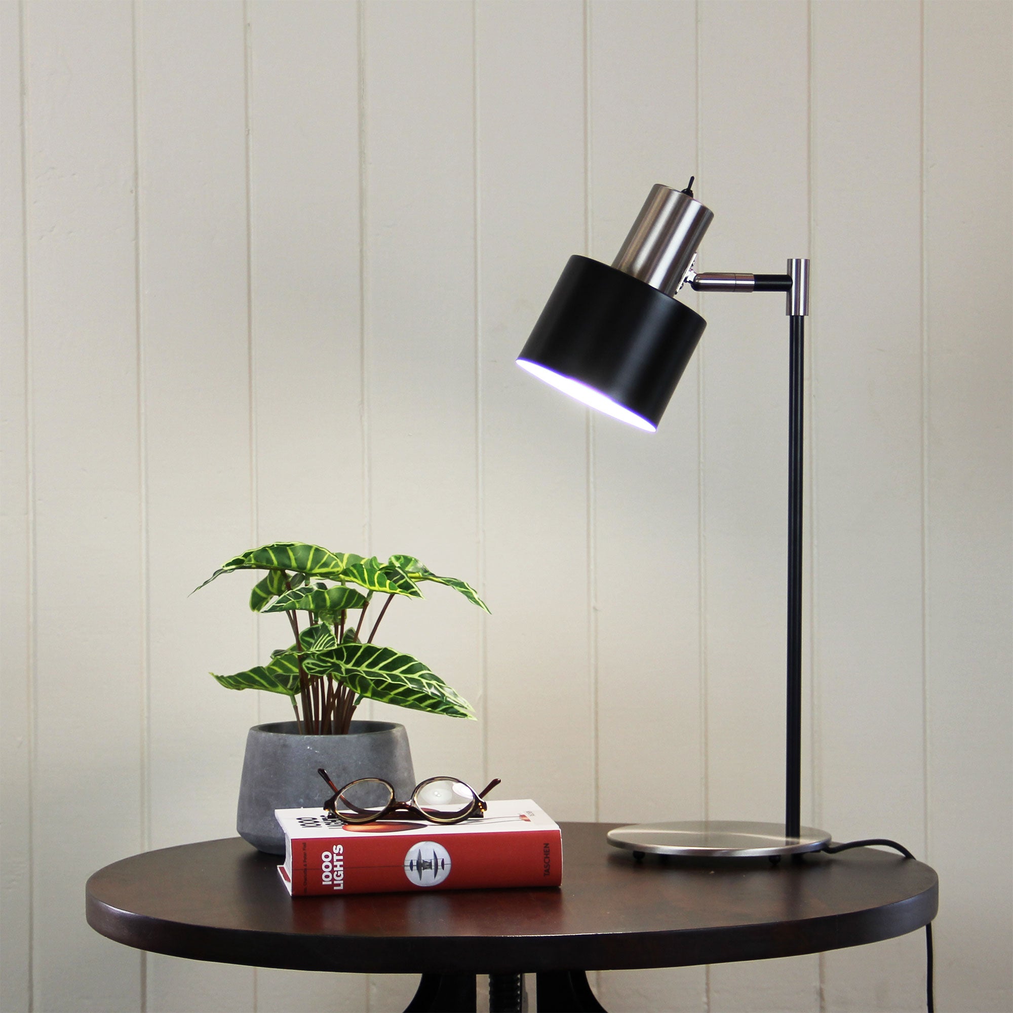Ari Mid-Century Desk Lamp Black and Brushed Chrome styled in a room