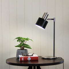 Ari Mid-Century Desk Lamp Black and Brushed Chrome styled in a room