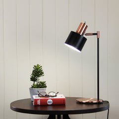 Ari Mid-century Desk Lamp Black and Brushed Copper styled in a room
