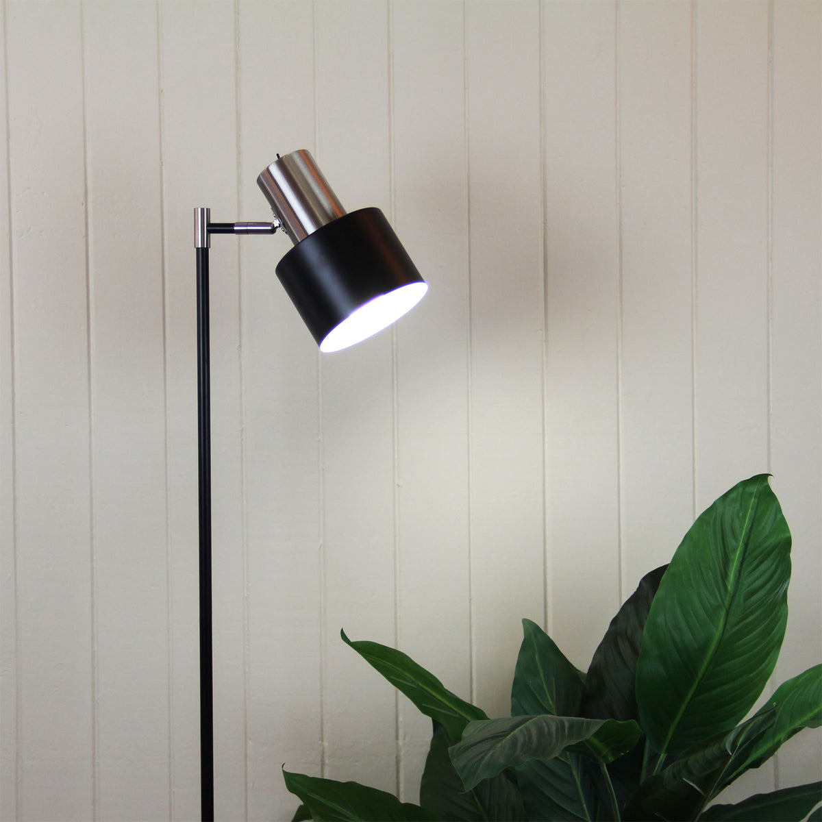 Ari Mid-Century Floor Lamp Black and Brushed Chrome styled in a room